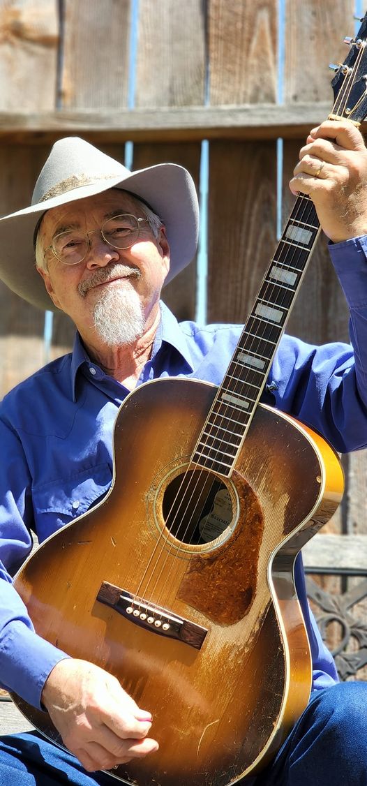 Rich Cloud holding his guitar